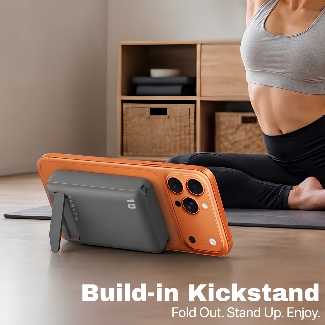 Phone propped upright on a yoga mat by the Parxen pack's fold-out kickstand